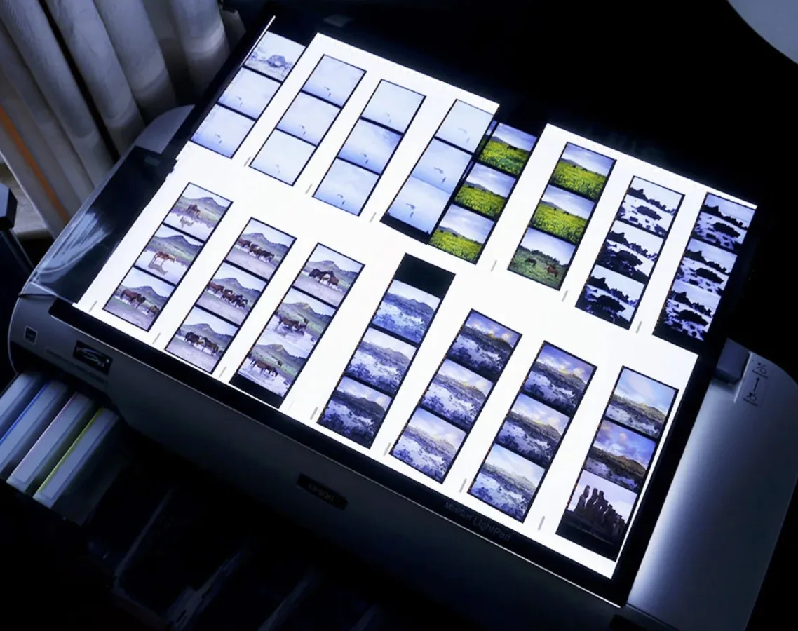 Light table with contact sheets in a working room